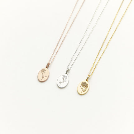 three gold, silver and rose gold necklaces